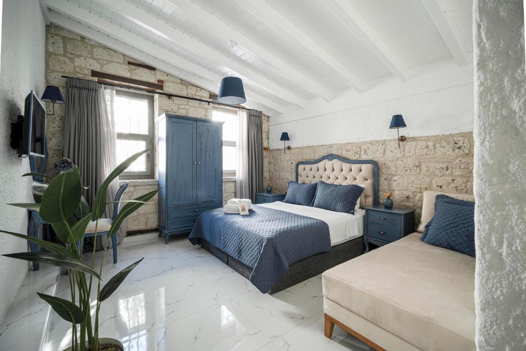 En eller flere senge i et værelse på Voger Alaçatı Family