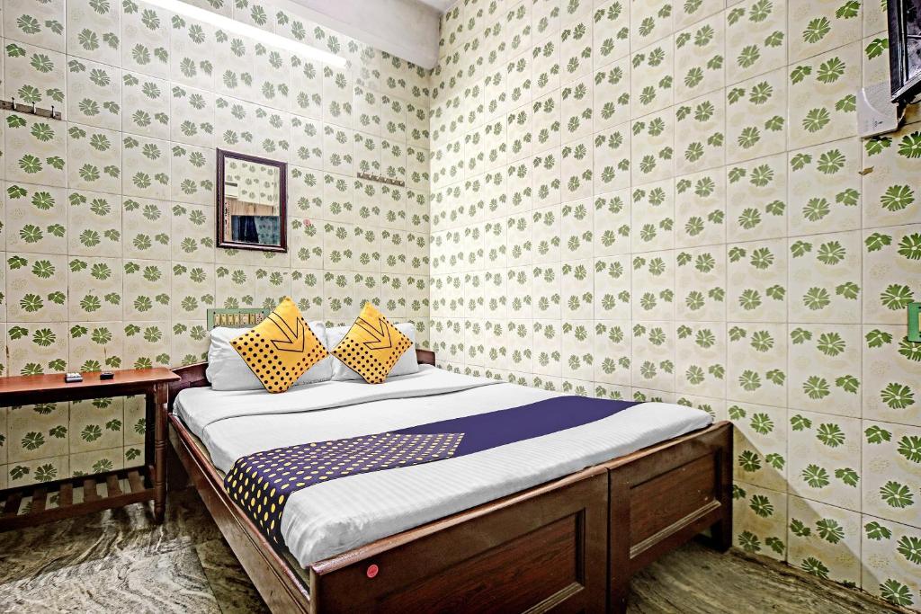 Postel nebo postele na pokoji v ubytování Hotel O Ams Annex