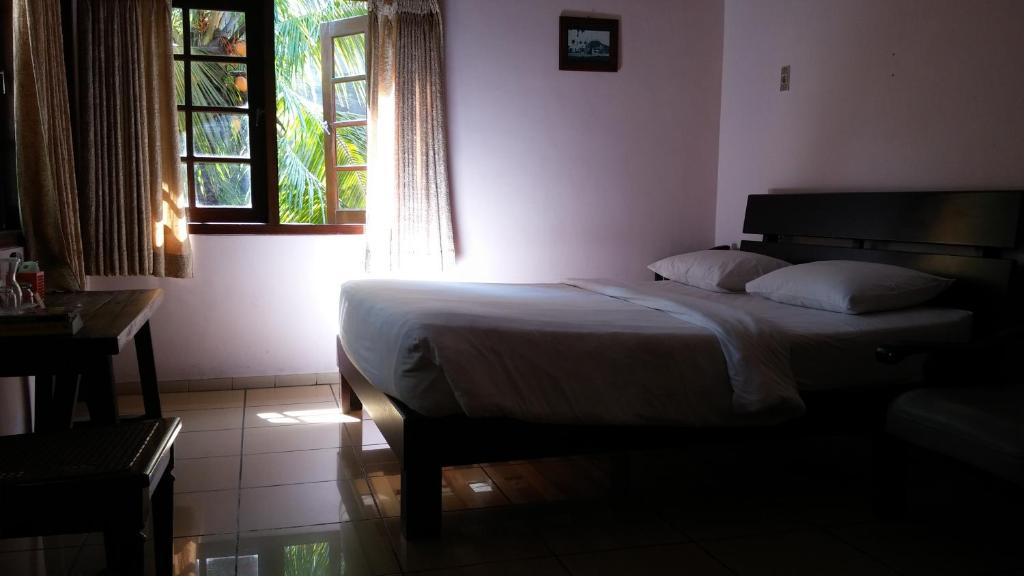 Postel nebo postele na pokoji v ubytování Peye Guesthouse