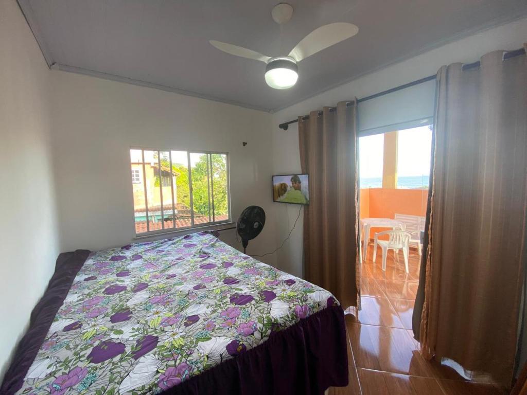 En eller flere senge i et værelse på Visão privilegiada Garatucaia