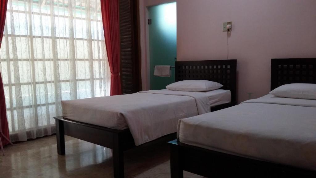 Postel nebo postele na pokoji v ubytování Peye Guesthouse