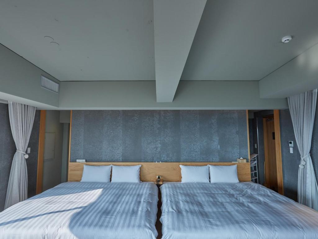 Postel nebo postele na pokoji v ubytování ANDO HOTEL NARA Wakakusayama -DLIGHT LIFE & HOTELS-