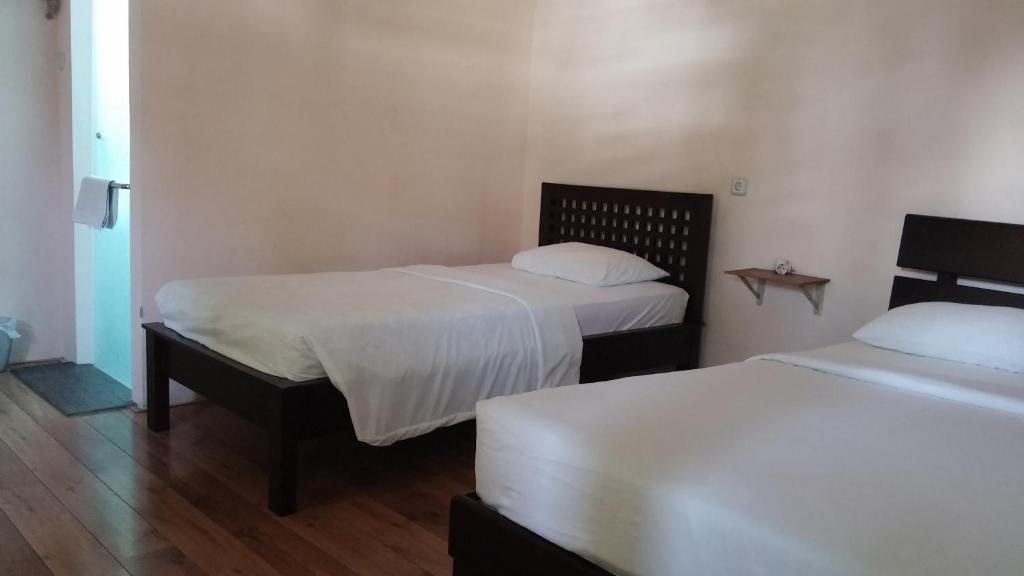 Postel nebo postele na pokoji v ubytování Peye Guesthouse