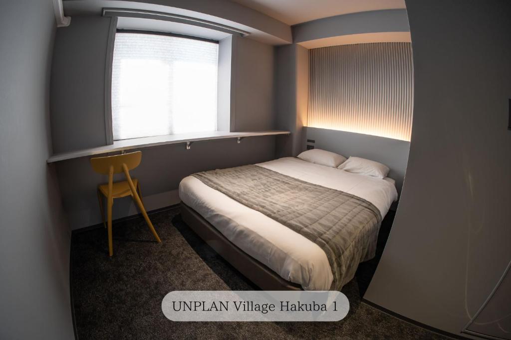 Postel nebo postele na pokoji v ubytování UNPLAN Village Hakuba