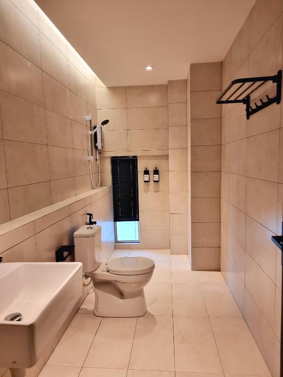 Koupelna v ubytování Roxy Hotel Malihah