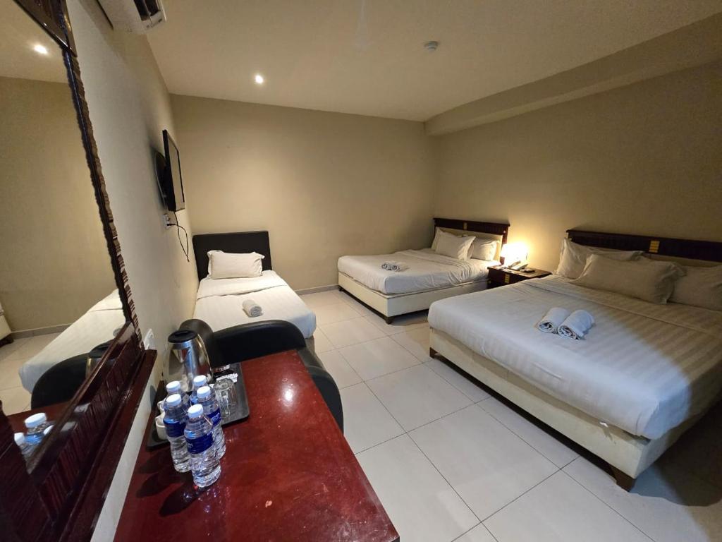 Postel nebo postele na pokoji v ubytování Hotel AL Amin