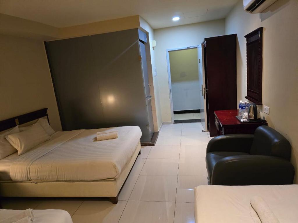 Postel nebo postele na pokoji v ubytování Hotel AL Amin