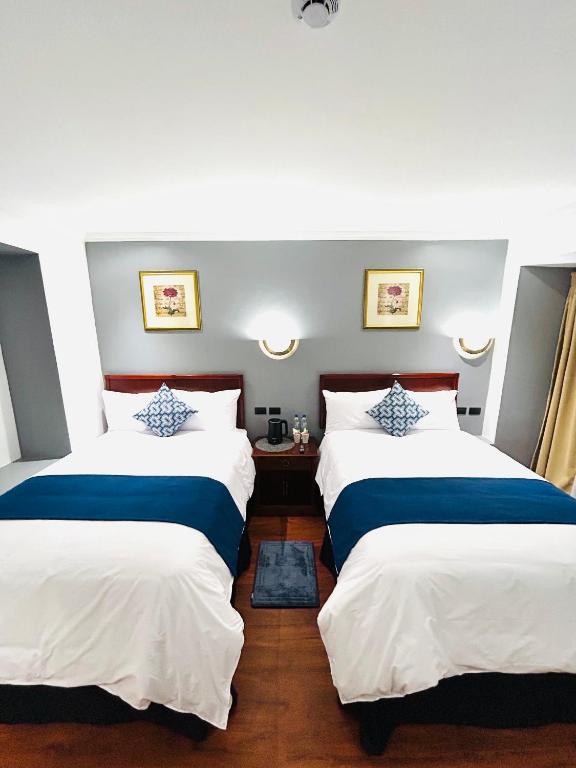 Postel nebo postele na pokoji v ubytování ACCEL Hotel Casa Nueva