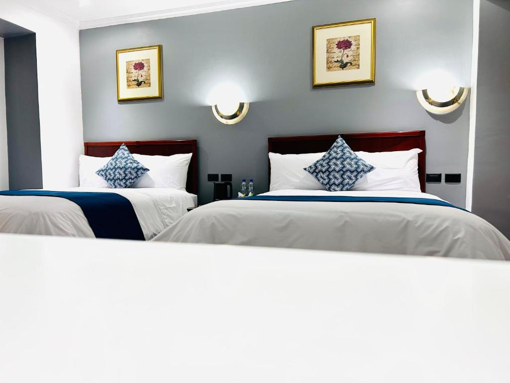 Postel nebo postele na pokoji v ubytování ACCEL Hotel Casa Nueva