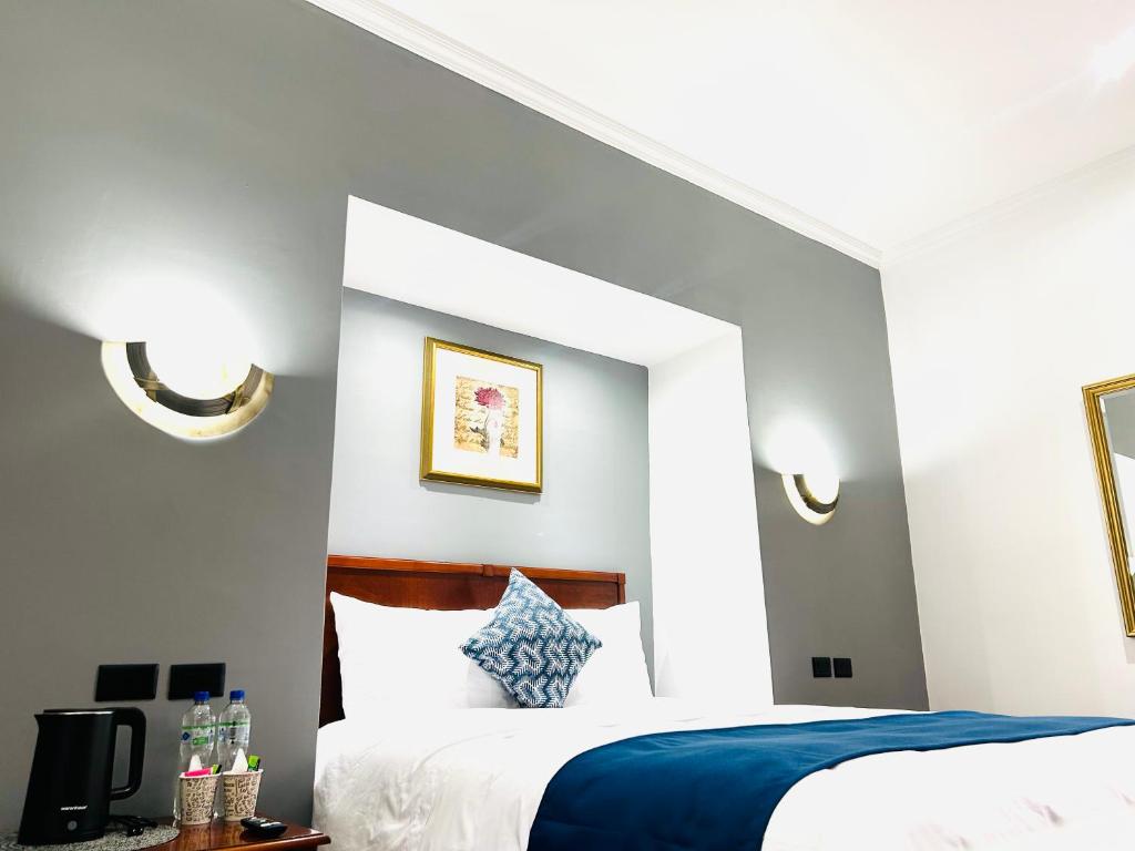 Postel nebo postele na pokoji v ubytování ACCEL Hotel Casa Nueva