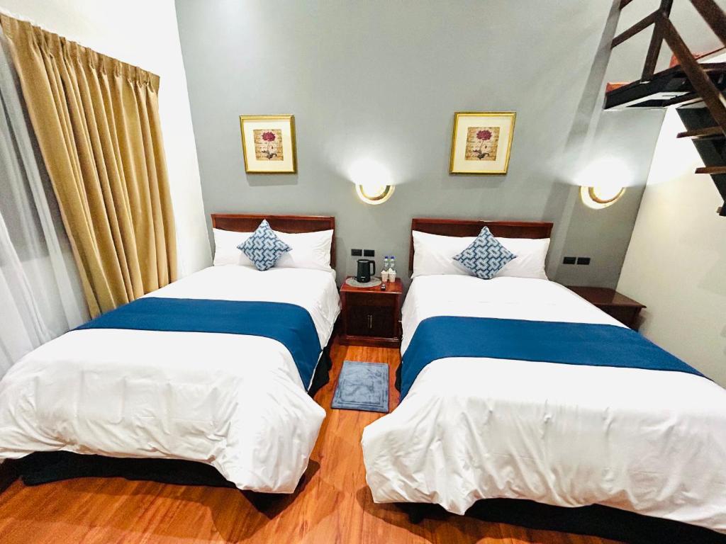 Postel nebo postele na pokoji v ubytování ACCEL Hotel Casa Nueva