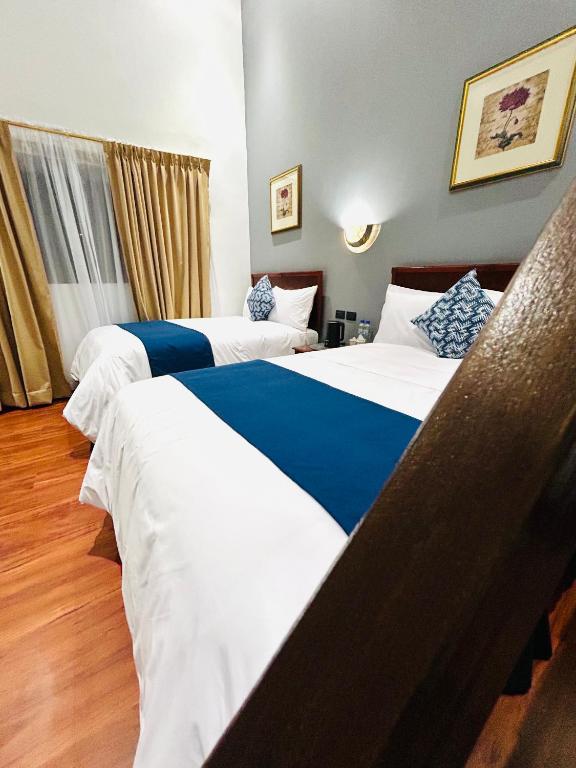 Postel nebo postele na pokoji v ubytování ACCEL Hotel Casa Nueva
