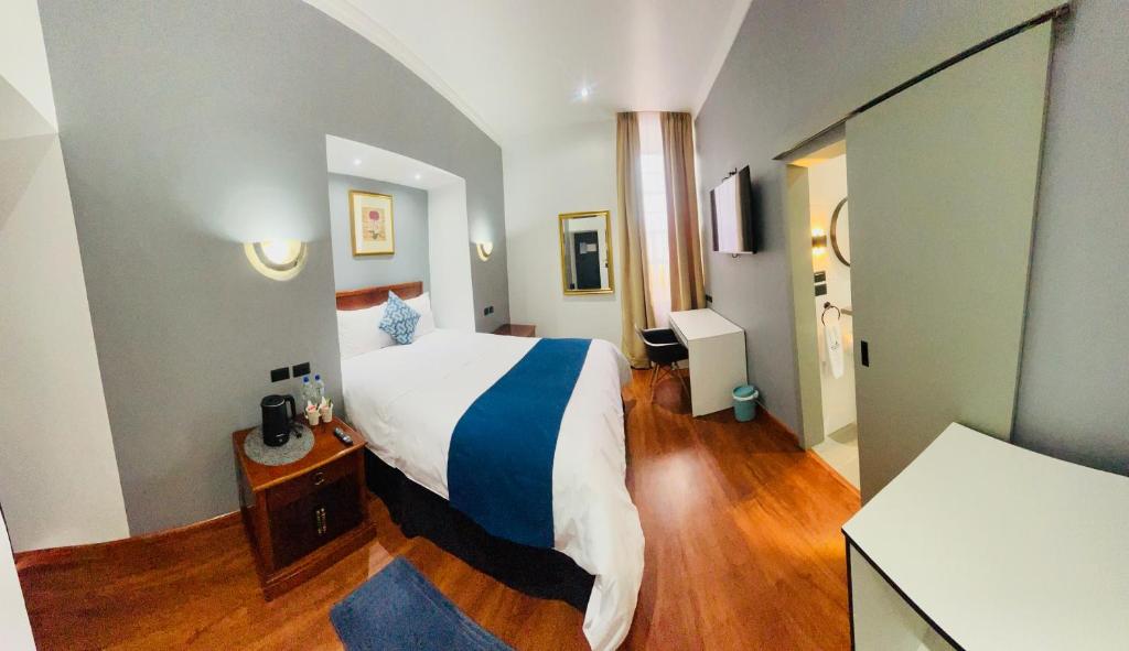 Postel nebo postele na pokoji v ubytování ACCEL Hotel Casa Nueva