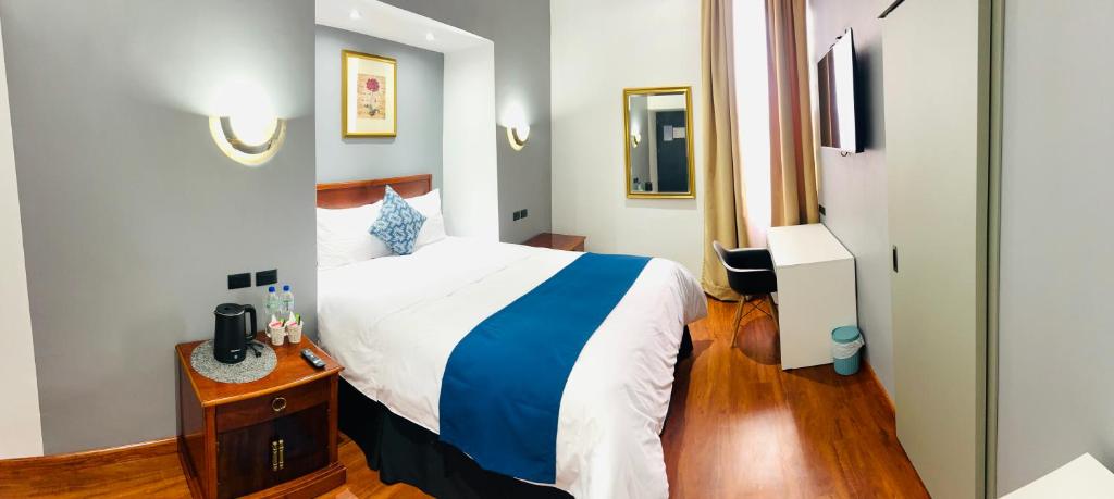 Postel nebo postele na pokoji v ubytování ACCEL Hotel Casa Nueva