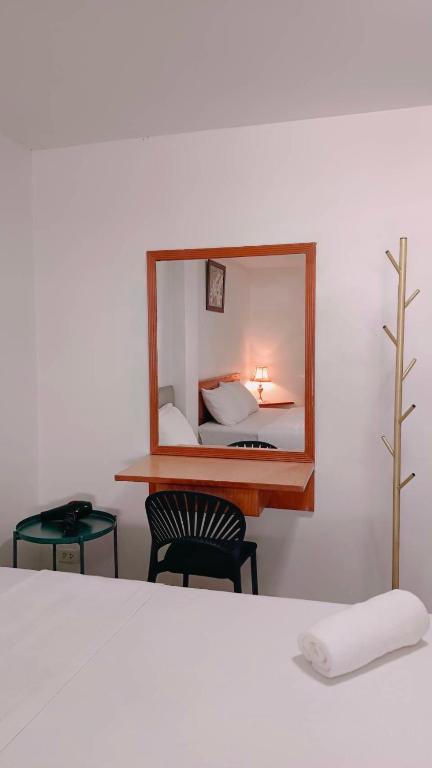 Postel nebo postele na pokoji v ubytování Convenient Resort