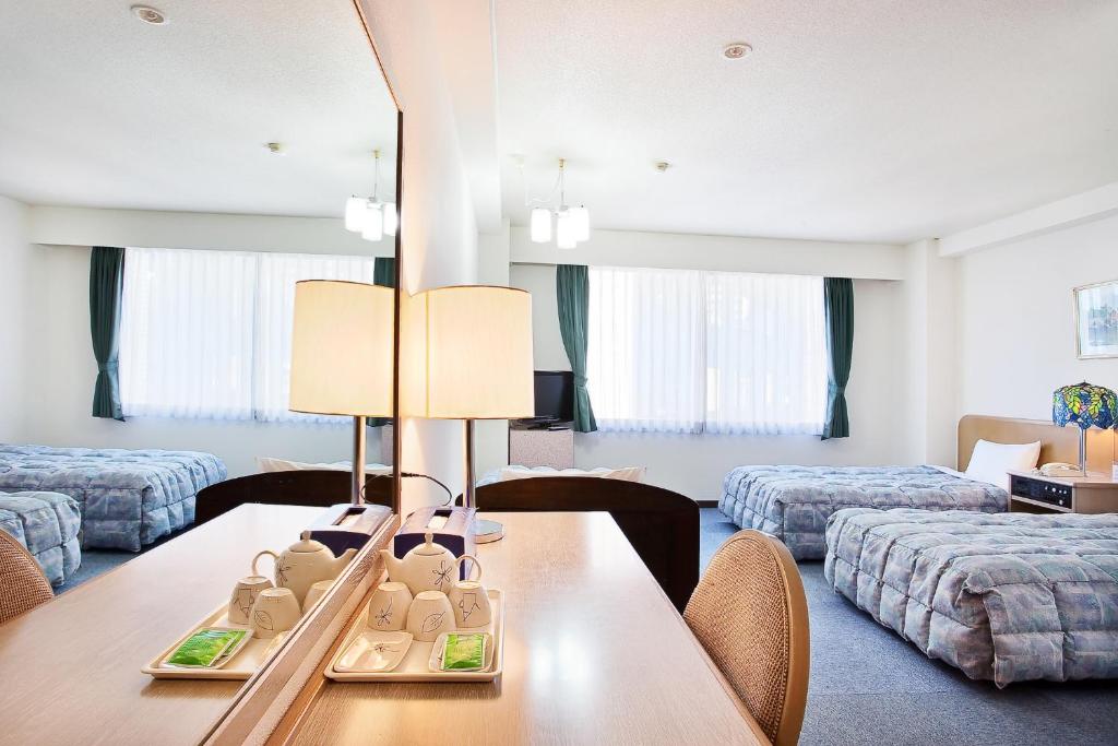 Postel nebo postele na pokoji v ubytování Hotel Luna Park