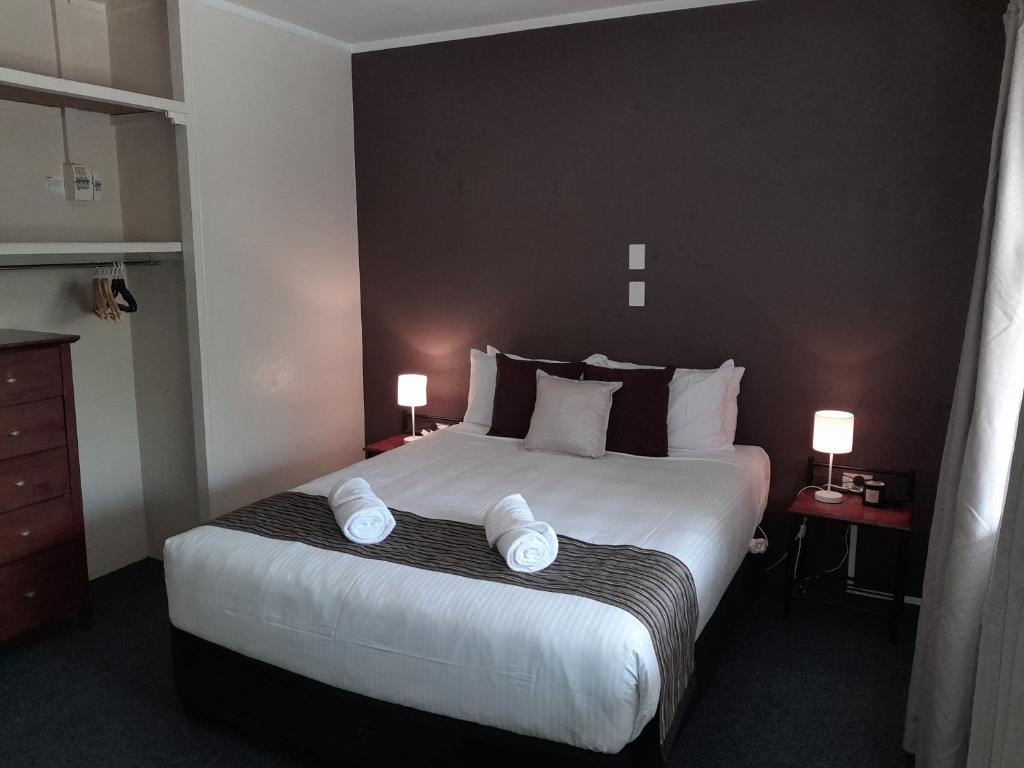 Postel nebo postele na pokoji v ubytování Murray Gardens Motel