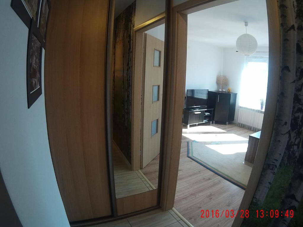 Televízia a/alebo spoločenská miestnosť v ubytovaní Apartament Masovia