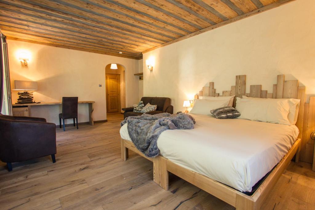 Postel nebo postele na pokoji v ubytování Hotel Les Montagnards