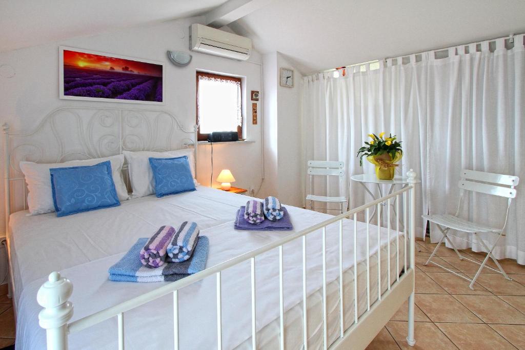 Postel nebo postele na pokoji v ubytování Holiday Home Marko Funtana