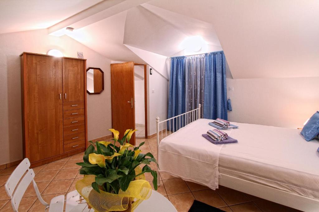 Postel nebo postele na pokoji v ubytování Holiday Home Marko Funtana