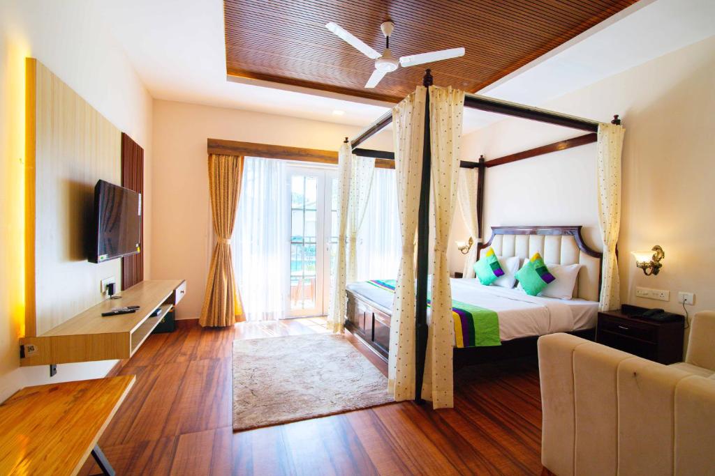 TV a/nebo společenská místnost v ubytování Treebo Greenland Resort, Patia