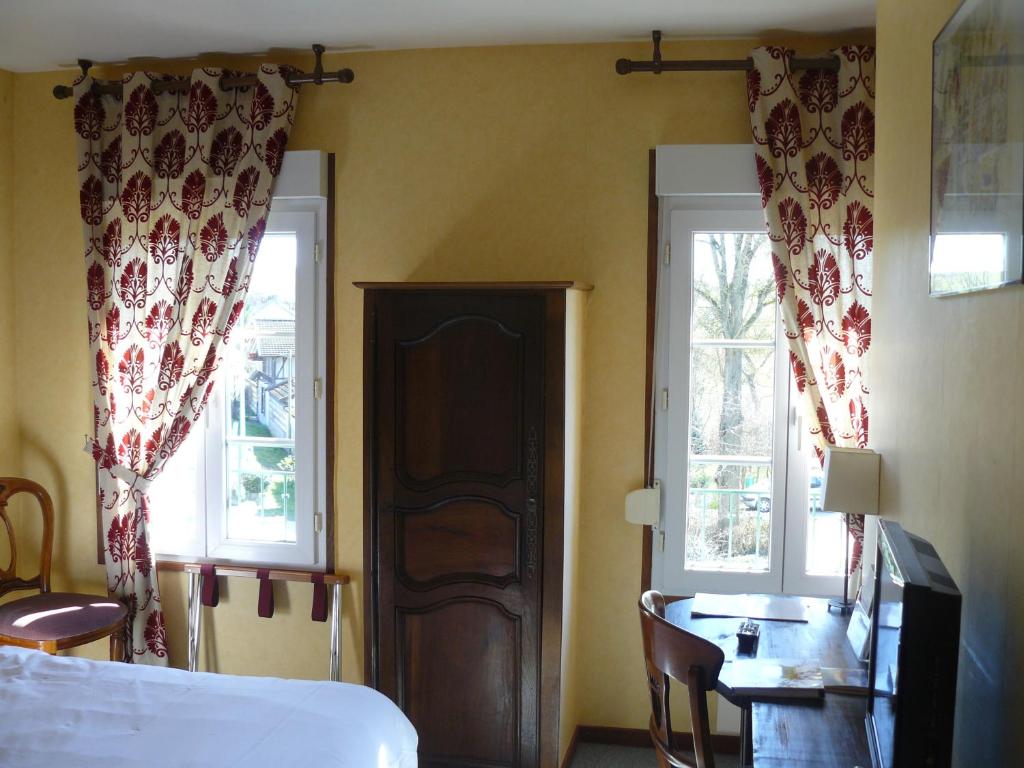 Postel nebo postele na pokoji v ubytování Le Clos De Mutigny