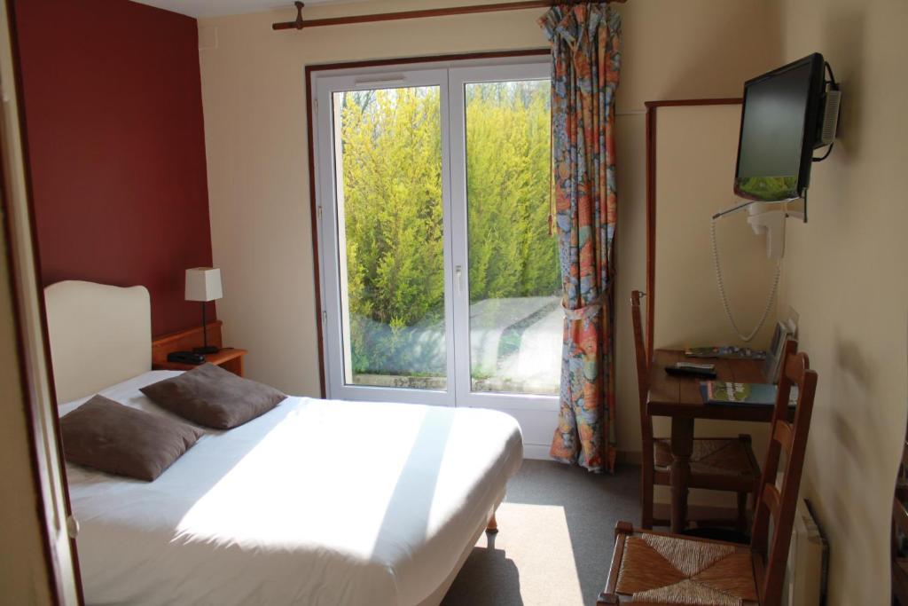 Postel nebo postele na pokoji v ubytování Le Clos De Mutigny
