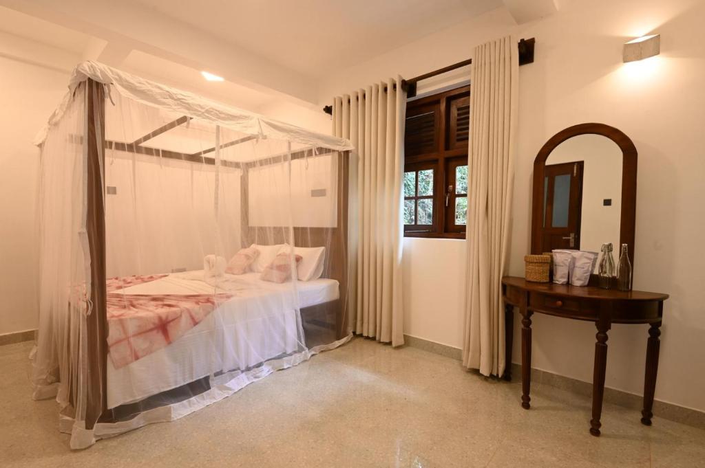 Postel nebo postele na pokoji v ubytování Darigala House