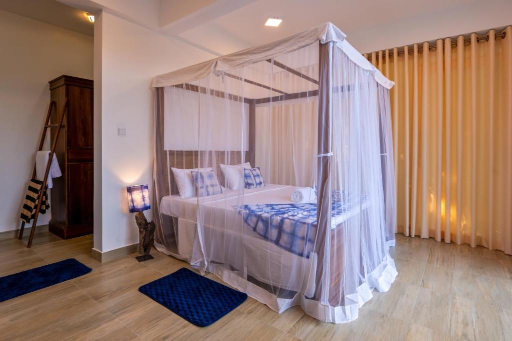 Postel nebo postele na pokoji v ubytování Darigala House