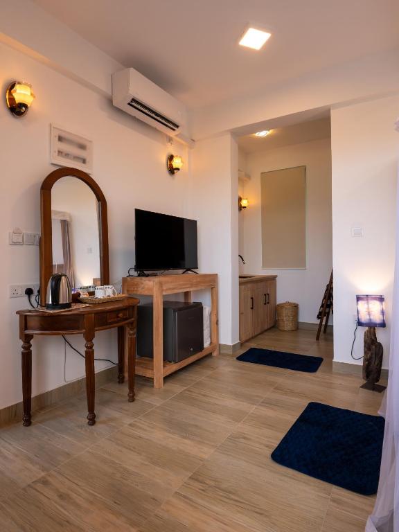 TV a/nebo společenská místnost v ubytování Darigala House