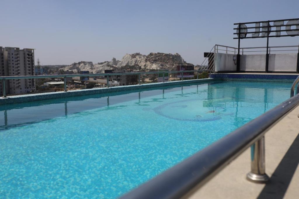 a large swimming pool on top of a building at NPG Hotel, Near Kempegowda International Airport in Dod Jāla