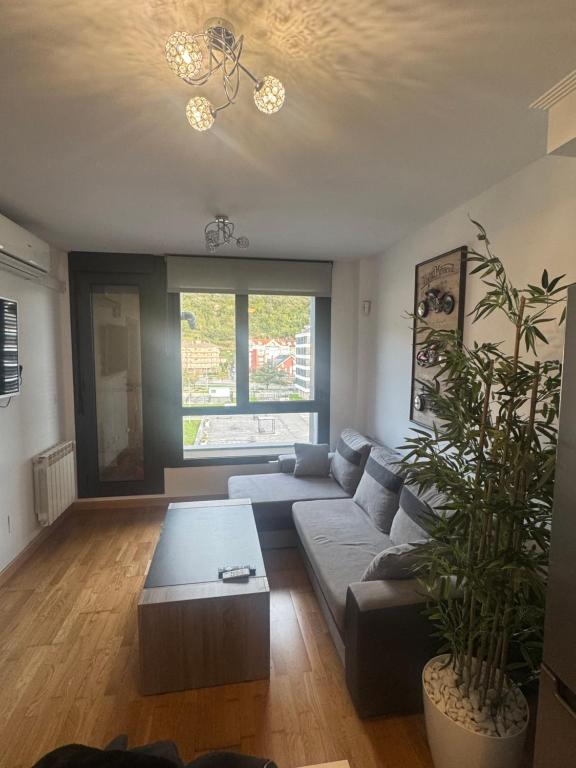 a living room with a couch and a table at Santoña in Santoña