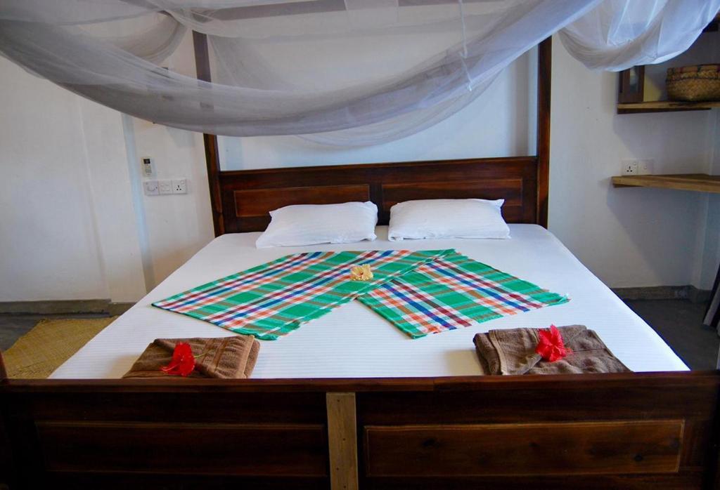Postel nebo postele na pokoji v ubytování Cili Hotel