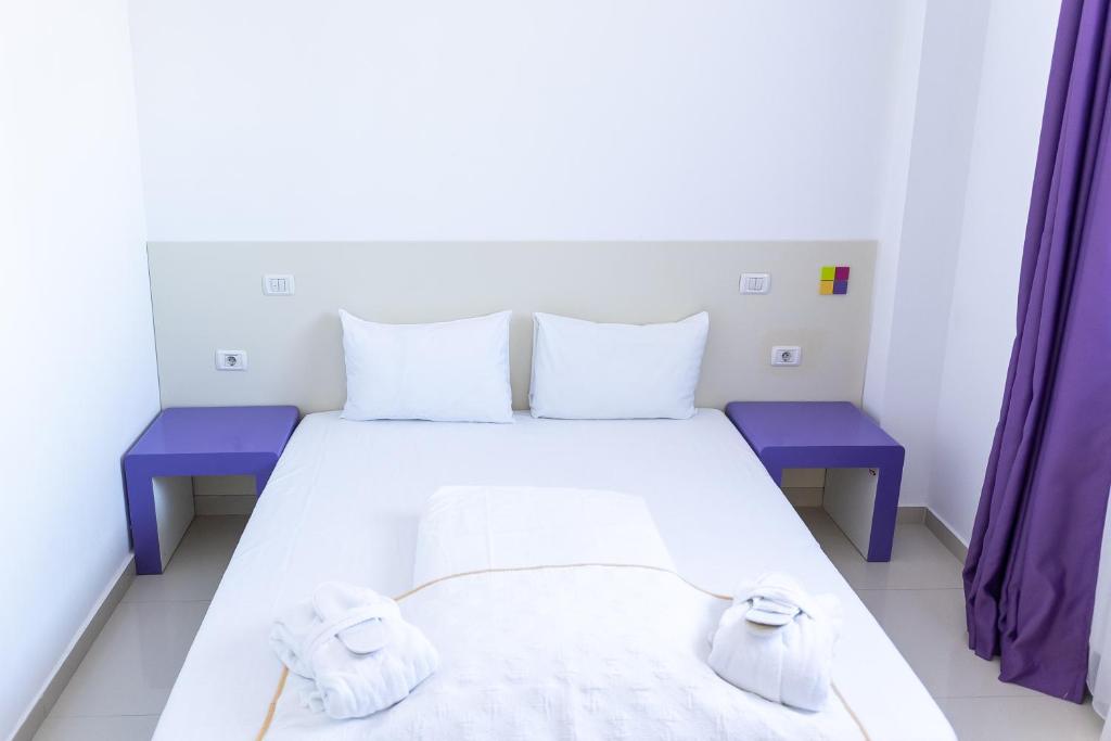 Postel nebo postele na pokoji v ubytování Hotel Christina Plus