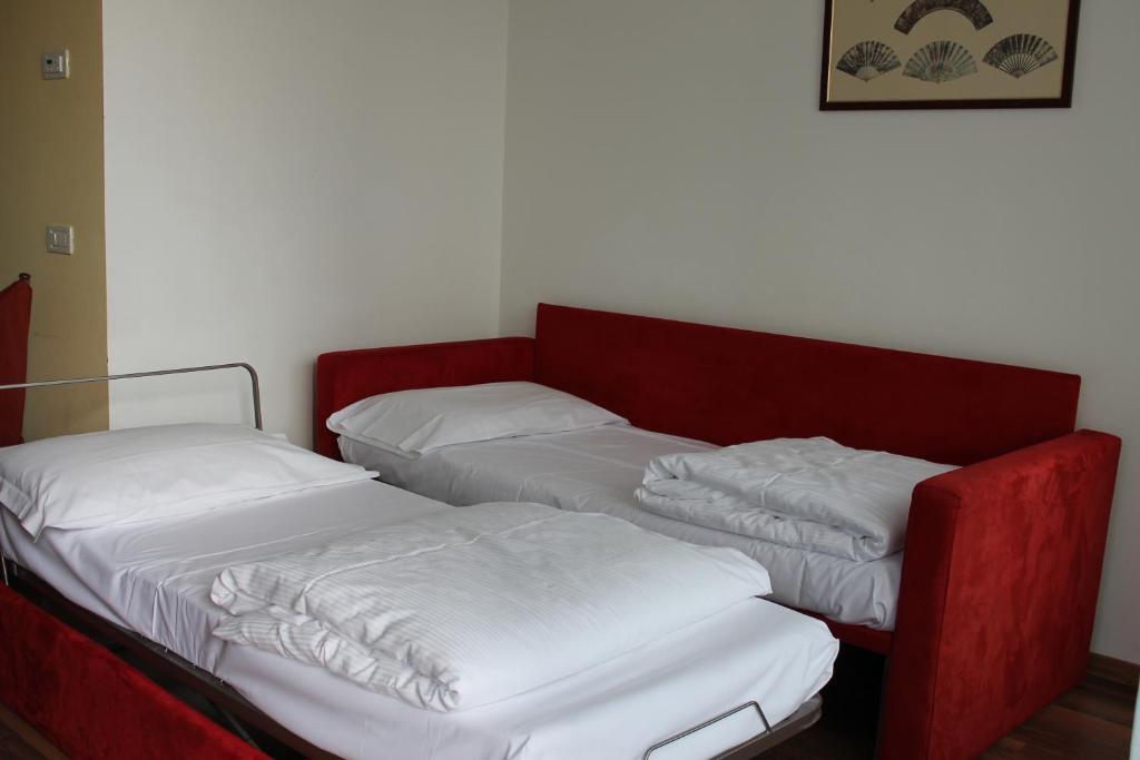 Postel nebo postele na pokoji v ubytování Hotel Baita Clementi