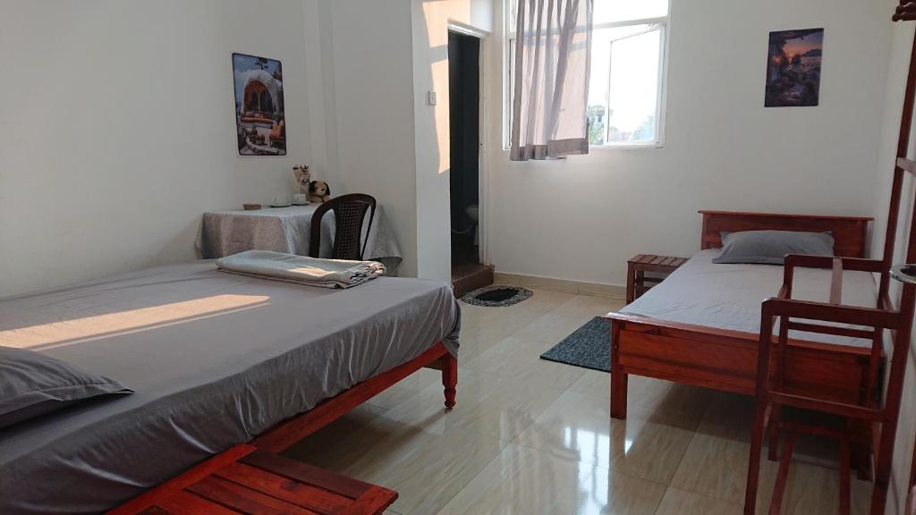 Postel nebo postele na pokoji v ubytování CANAAN MUSIC Hotel