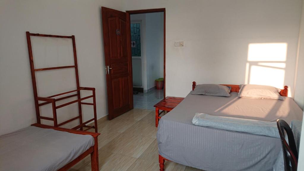 Postel nebo postele na pokoji v ubytování CANAAN MUSIC Hotel