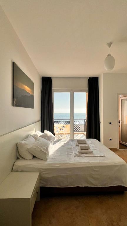 Postel nebo postele na pokoji v ubytování Hotel Brilant