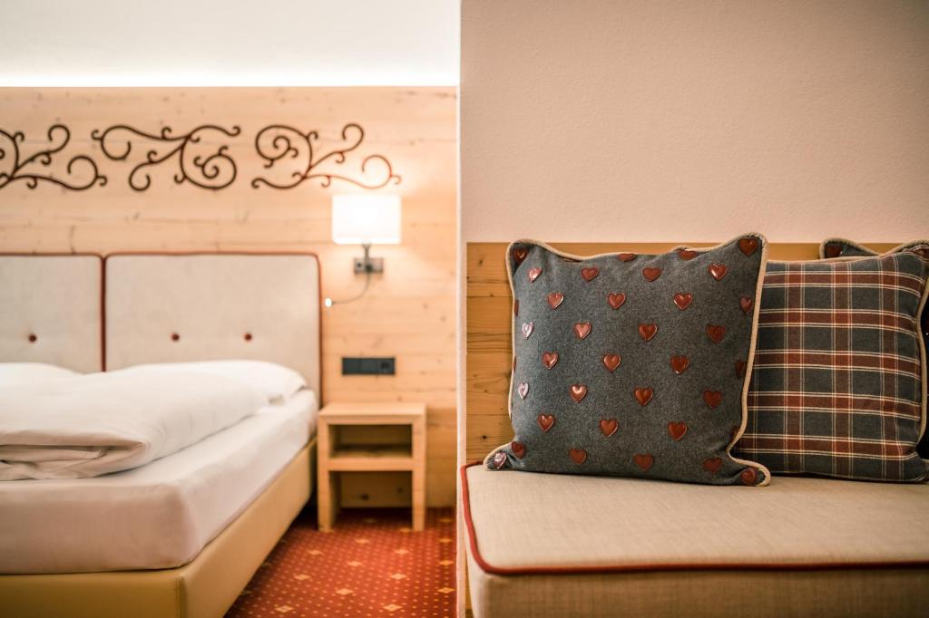 Postel nebo postele na pokoji v ubytování Hotel Maria