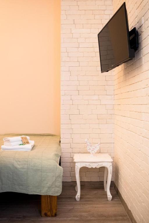 Televízia a/alebo spoločenská miestnosť v ubytovaní Apartamenty Starówka - w otulinie Starego Miasta