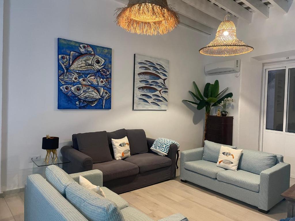 a living room with a couch and two chairs at Casa de Santa María in El Puerto de Santa María