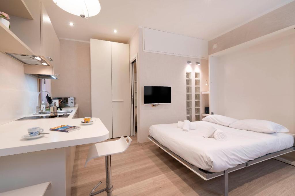 Łóżko lub łóżka w pokoju w obiekcie Casa del Pittore Rialto