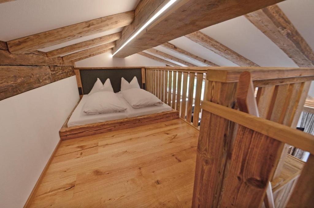 Postel nebo postele na pokoji v ubytování Nebenhaus Sagritzerwirt