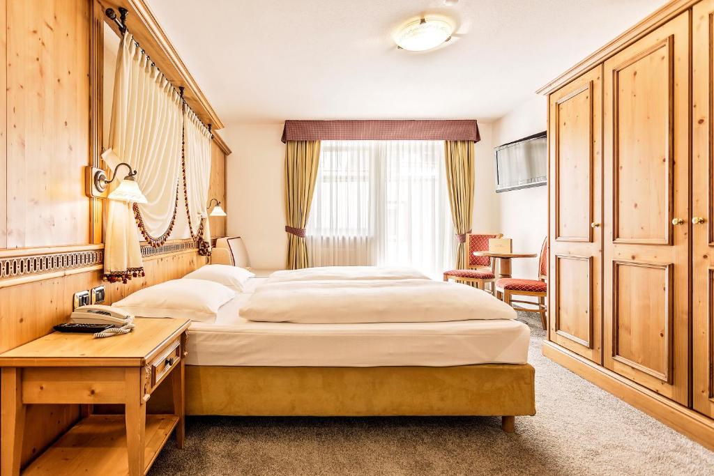 Postel nebo postele na pokoji v ubytování Hotel Maria