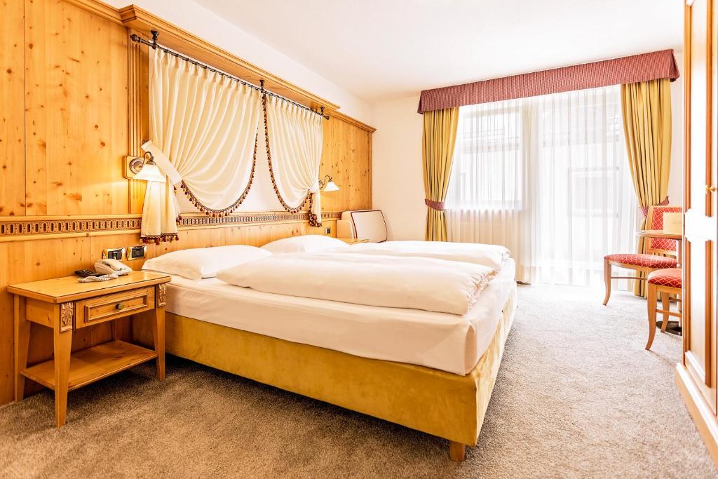Postel nebo postele na pokoji v ubytování Hotel Maria
