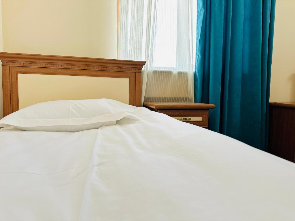 Postel nebo postele na pokoji v ubytování SD Hotel