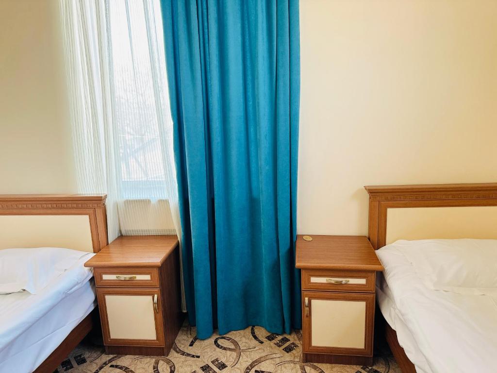Postel nebo postele na pokoji v ubytování SD Hotel