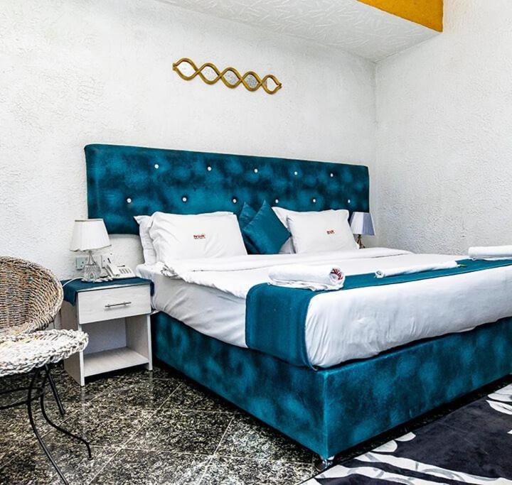 Postel nebo postele na pokoji v ubytování Nur Complex Hotel & Apartment