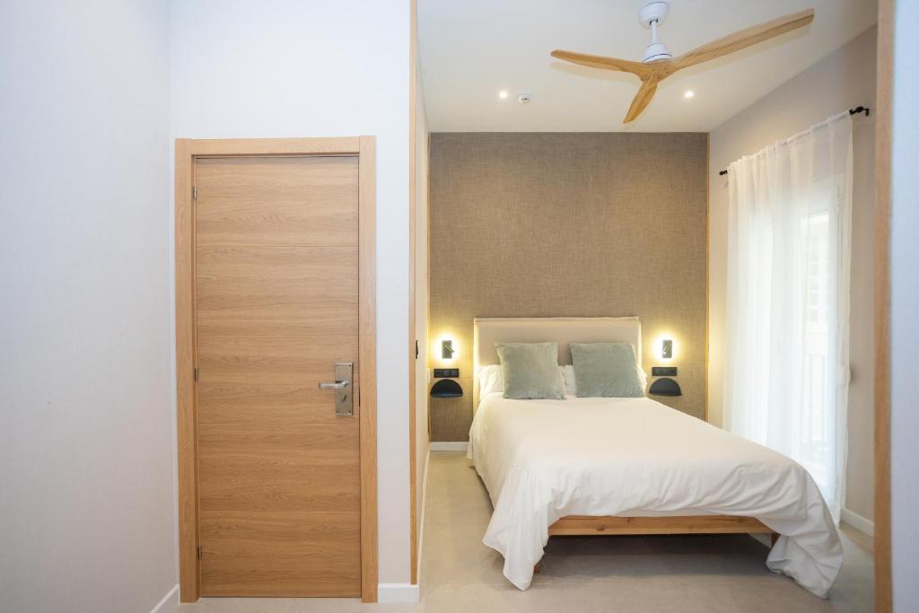 Posteľ alebo postele v izbe v ubytovaní Chinitas Urban Rooms